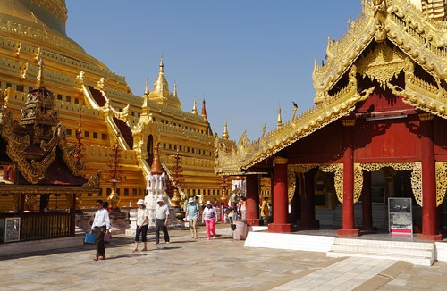 Base of Shwezigon Pagoda with tourists