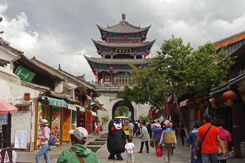 Modern Dali steet scene with gateway and three tiered pagoda tower