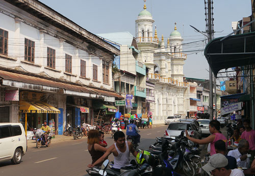 Mosque with busy restaurant in foreground